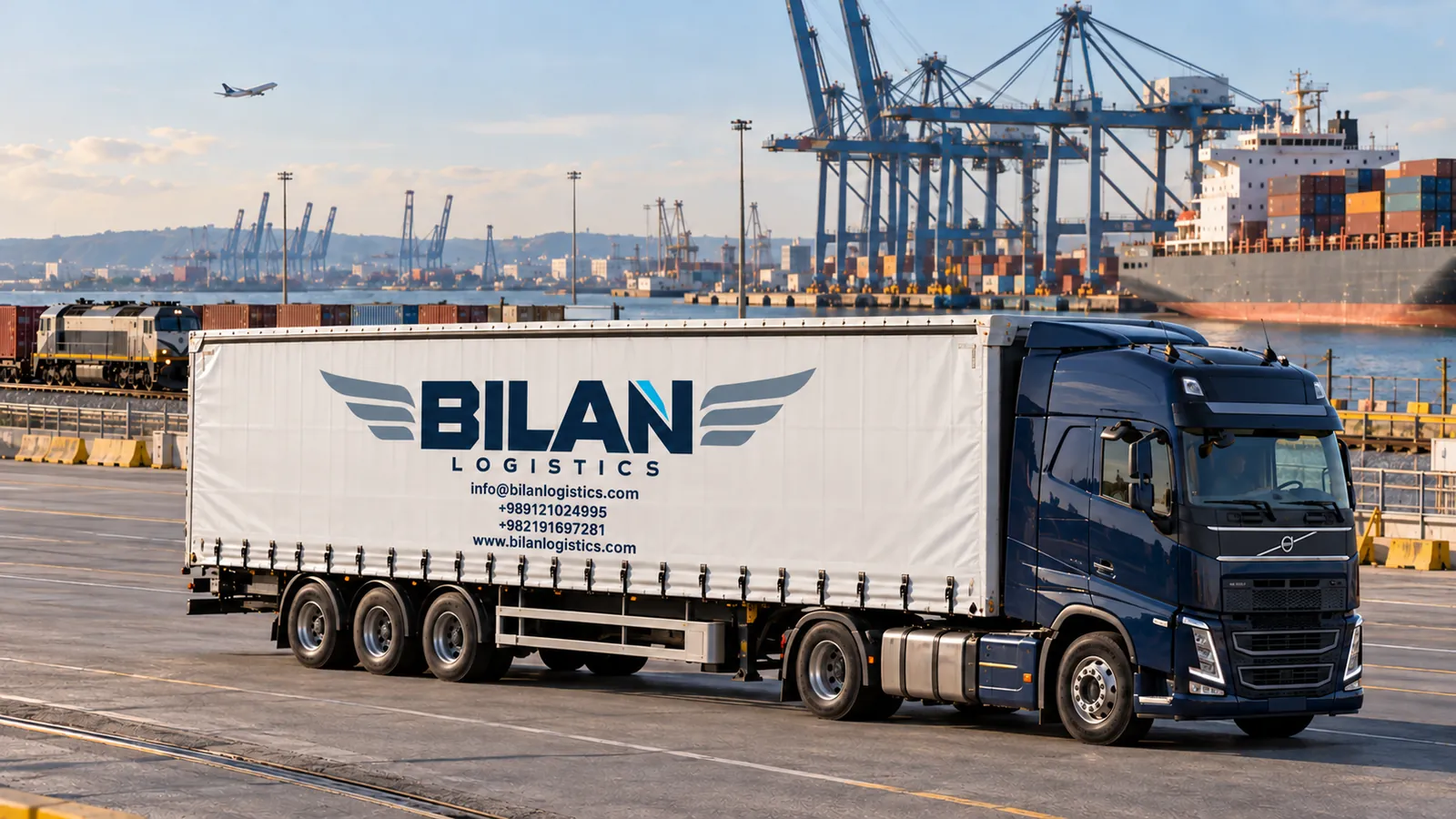 Curtainsider displaying the new Bilan Logistics branding at a freight terminal
